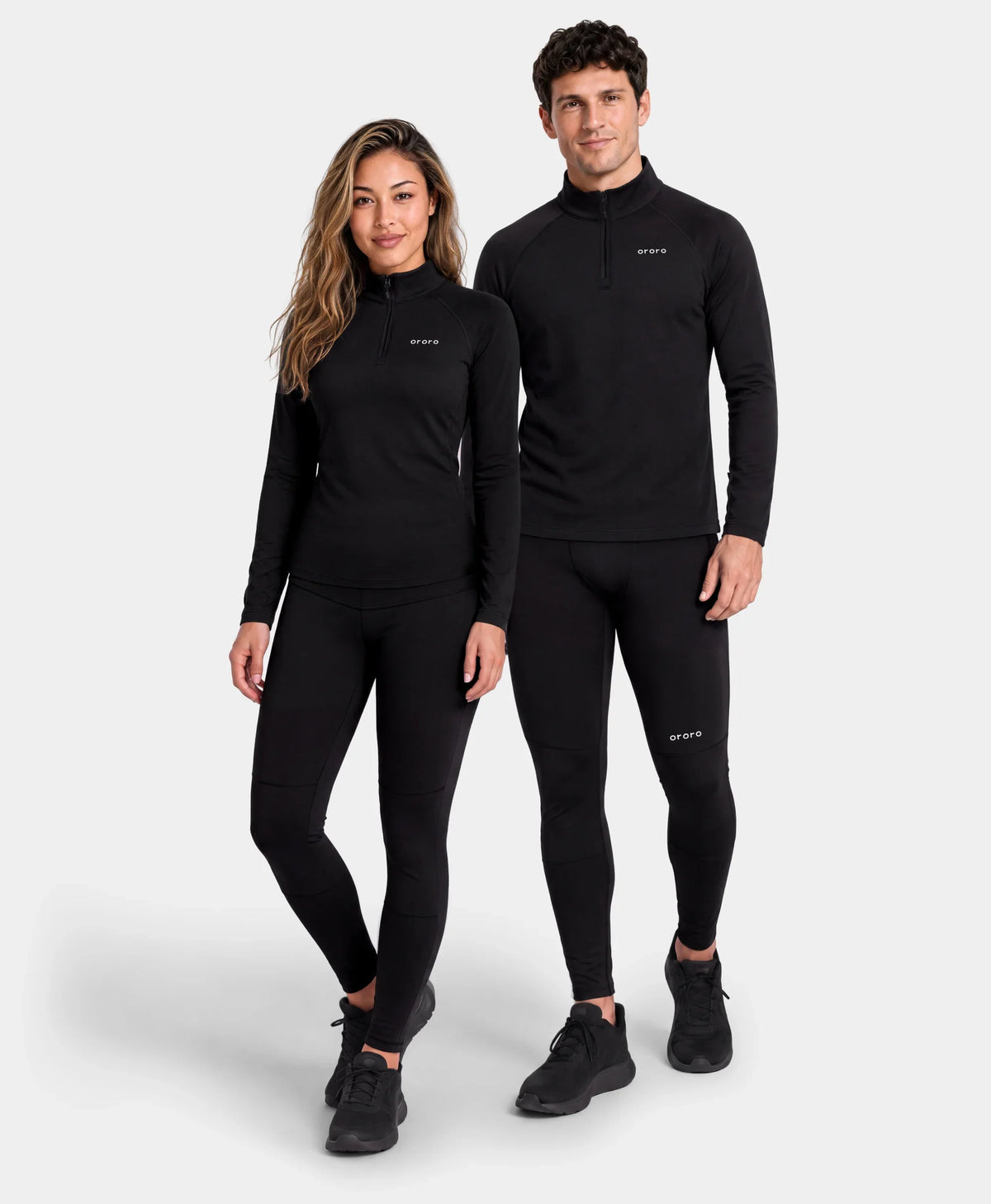 Models wearing matching black quarter-zip top and bottom