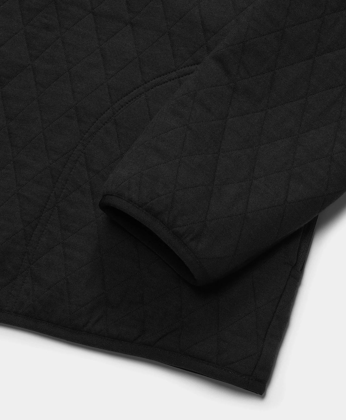 Close-up of the sleeve cuff and hem texture on an ororo black heated jacket.