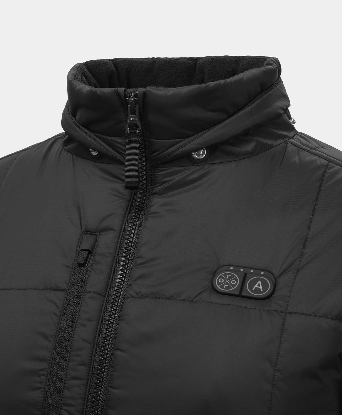 Close-up of a black puffer jacket with a high collar, front zipper, and a small circular control panel with buttons on the chest.