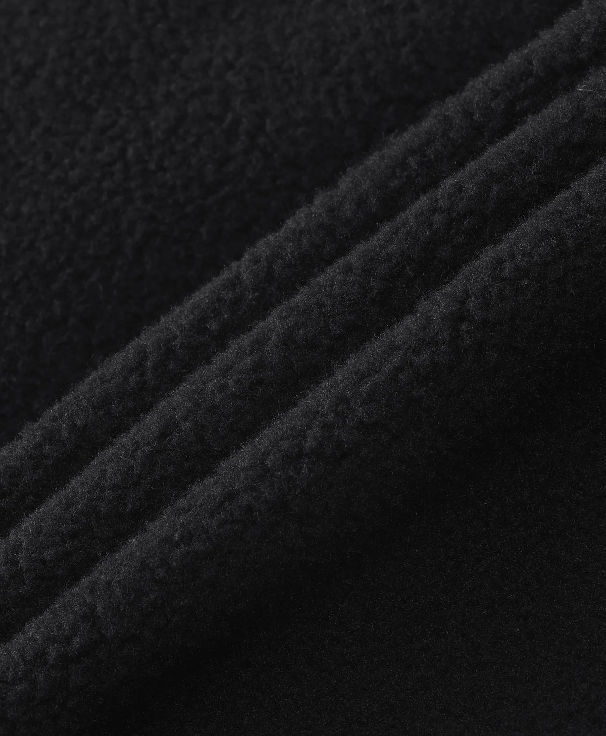 Close-up of the soft brushed fleece texture of the Men's 5-Zone Heated Tech Fleece Jacket