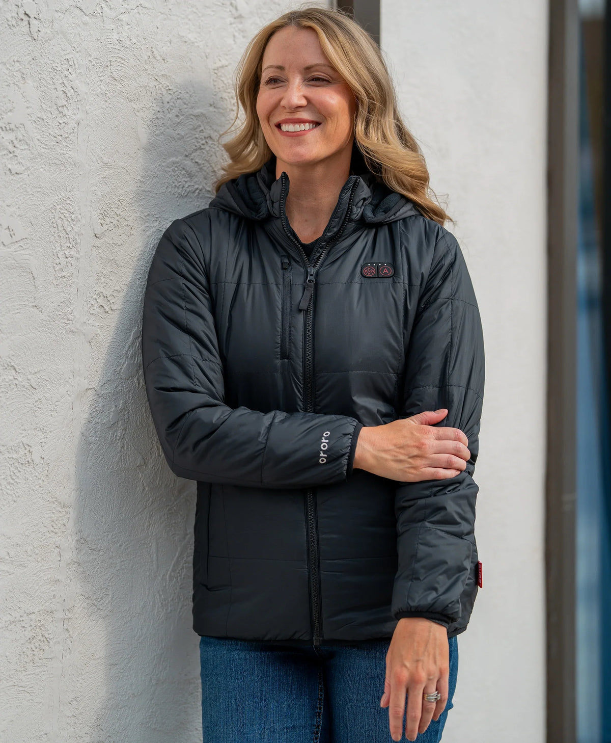Women's Overland 7-Zone Heated Box Quilted Jacket with Heated Hood in black, worn outdoors
